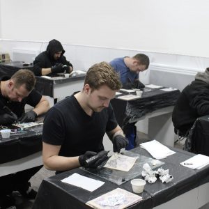 tattoo piercing academy students training on our tattoo course